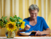 Senior Citizen eating a meal at home